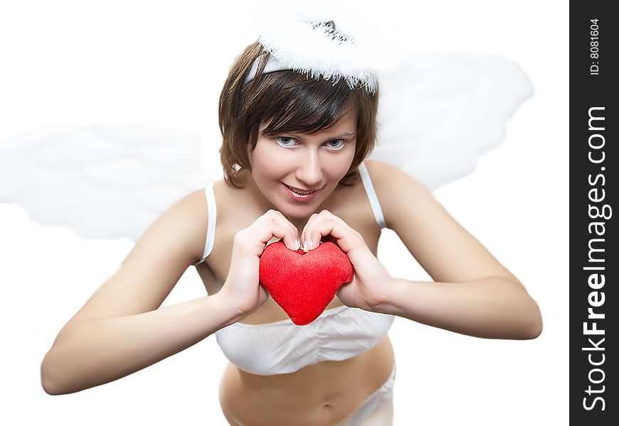 Young woman in angel's costume with red heart, isolated on white