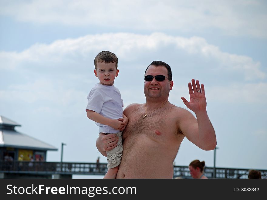 A father and son bond at the beach. A father and son bond at the beach