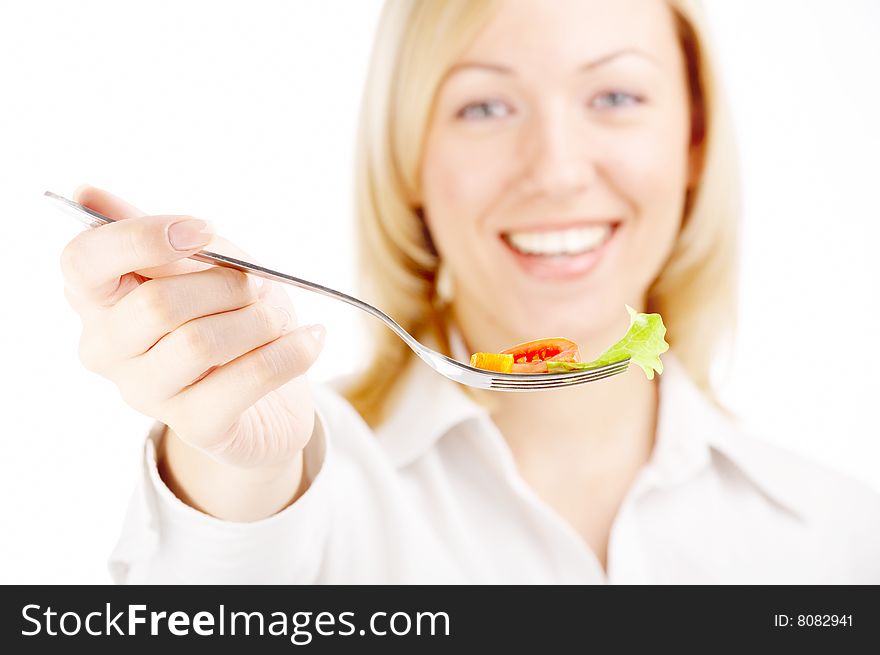 The smiling blonde holds a plug with the salad, isolated. The smiling blonde holds a plug with the salad, isolated
