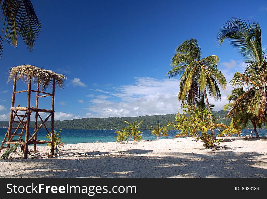 White beach with palms and lookout on Isla Catalina, Dominican Republic. White beach with palms and lookout on Isla Catalina, Dominican Republic