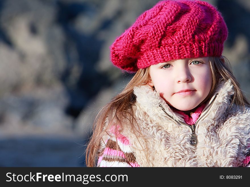 Young girl on the beach alone