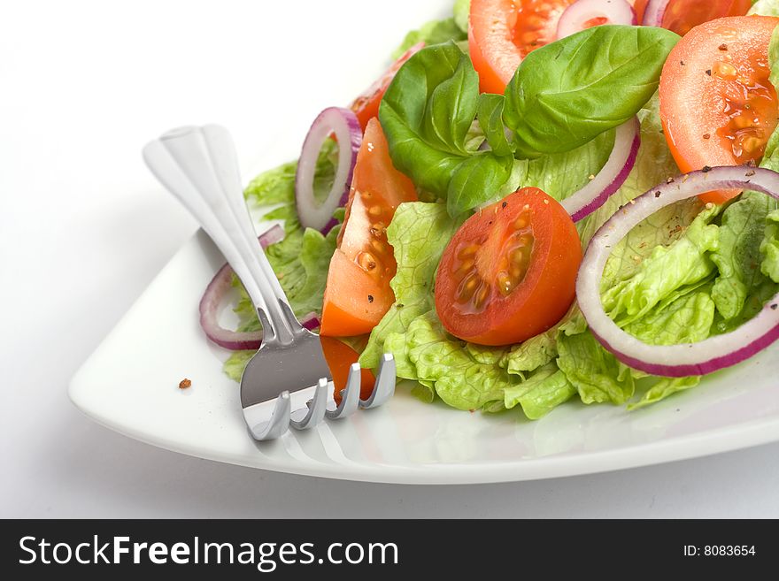 Healthy salad with lettuce, tomato, onion