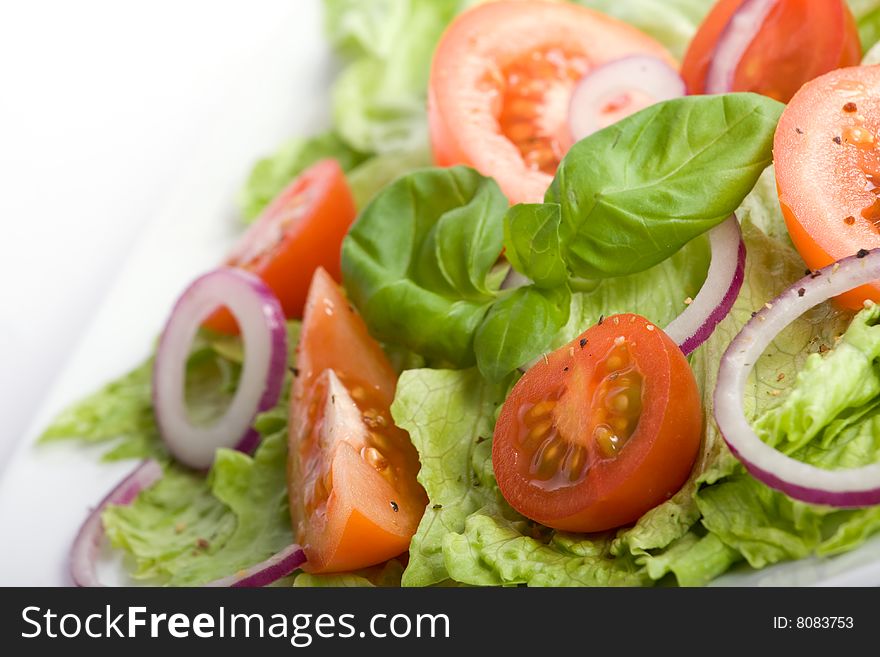 Healthy salad with lettuce, tomato, onion