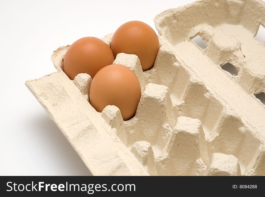 Eggs in cardboard packing. on a white background