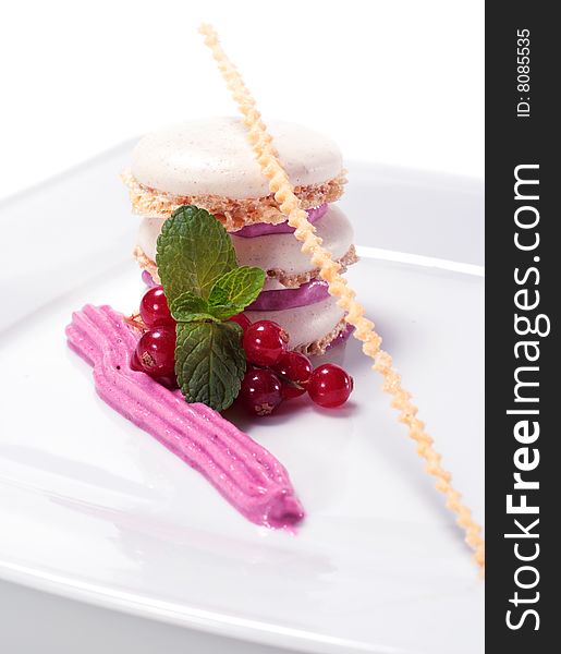 Meringue Cake with Blackberries Mousse and Fresh Mint Leaf and Fresh Berries. Isolated on White Background. Meringue Cake with Blackberries Mousse and Fresh Mint Leaf and Fresh Berries. Isolated on White Background