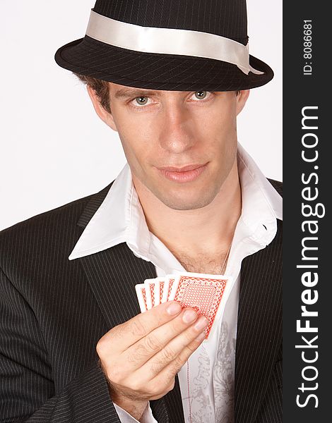 Poker player with cards in hand looking up
