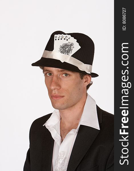 Portrait of poker player with royal flush in hat