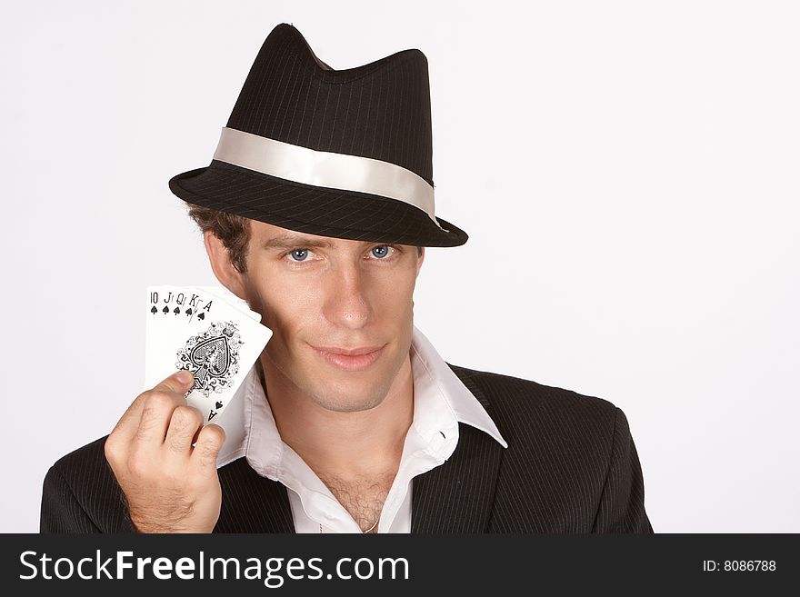 Poker player smirking with winning hand of royal flush. Poker player smirking with winning hand of royal flush
