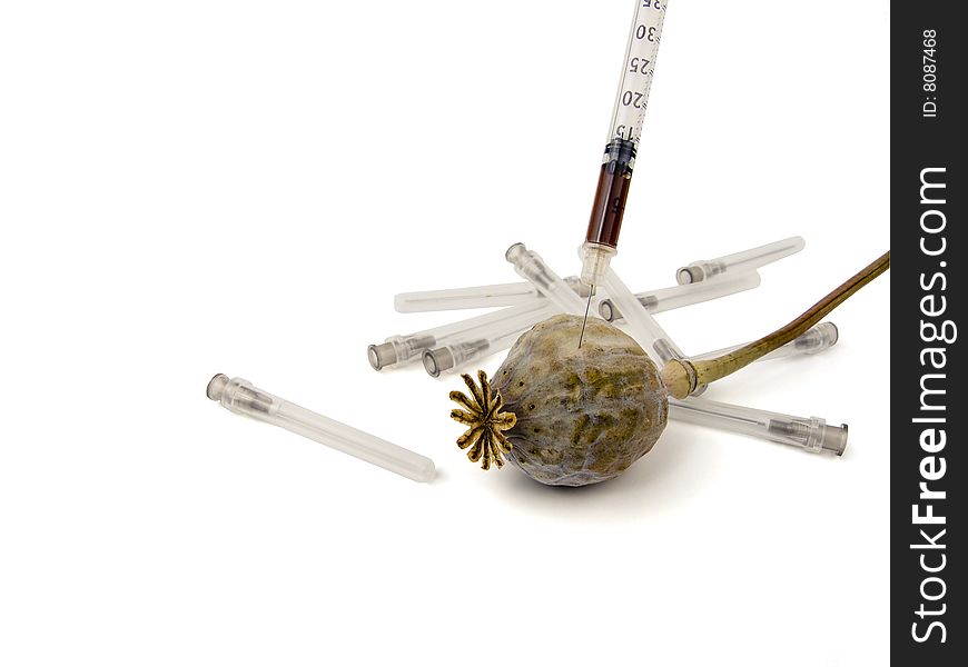 Syringe with a drug from a poppy. Syringe with a drug from a poppy