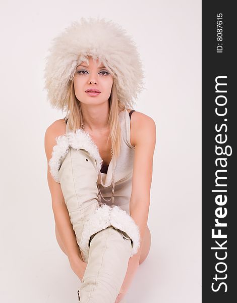 Young girl in furry hat, studio shot