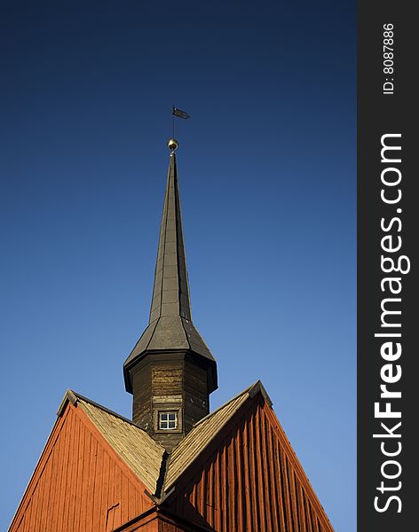 Wooden chapel with blue background