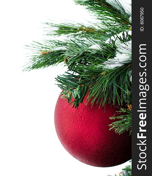 Red christmas-tree decoration with green needles isolated on white