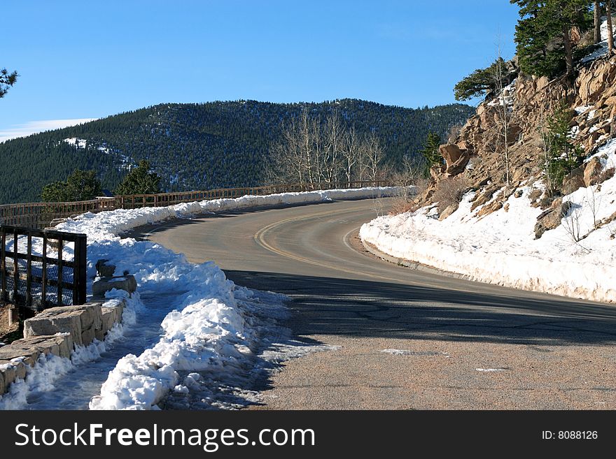 Road in snowy mountains, image was taken in Rocky mountains
