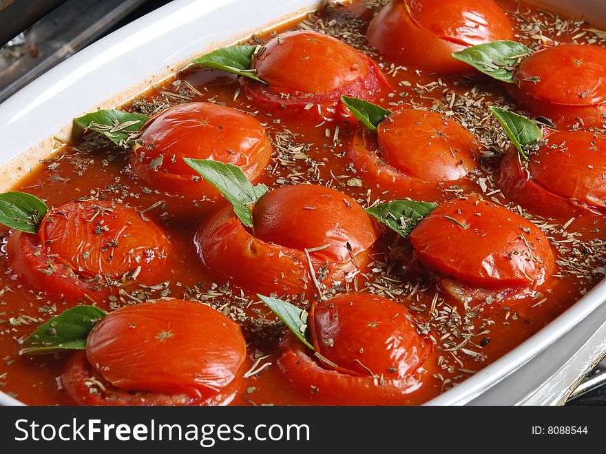 Fresh appetizing cherry tomatoes with water drops on a white background