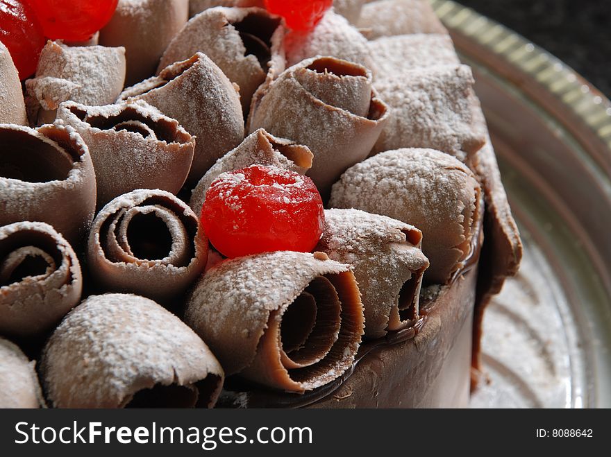 Cake with cherries and chocolate sugar, cherries