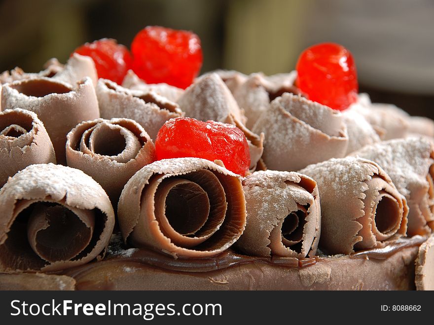 Cake with cherries and chocolate sugar, cherries