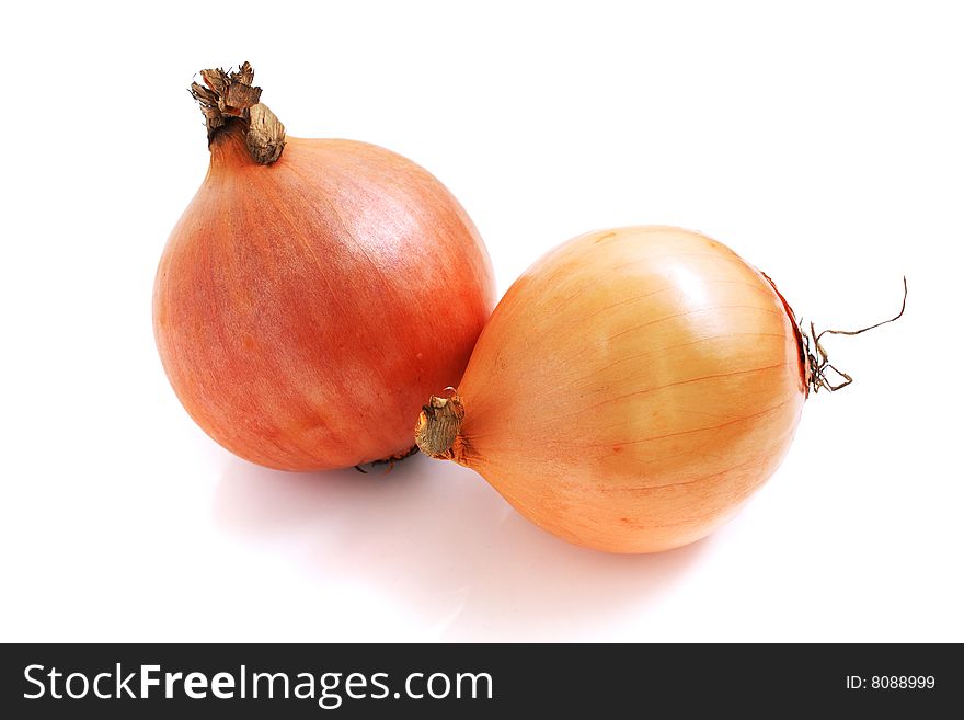 Close up of two onions isolated over white background.