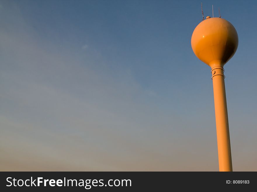 Water tower with the evening sky in the background