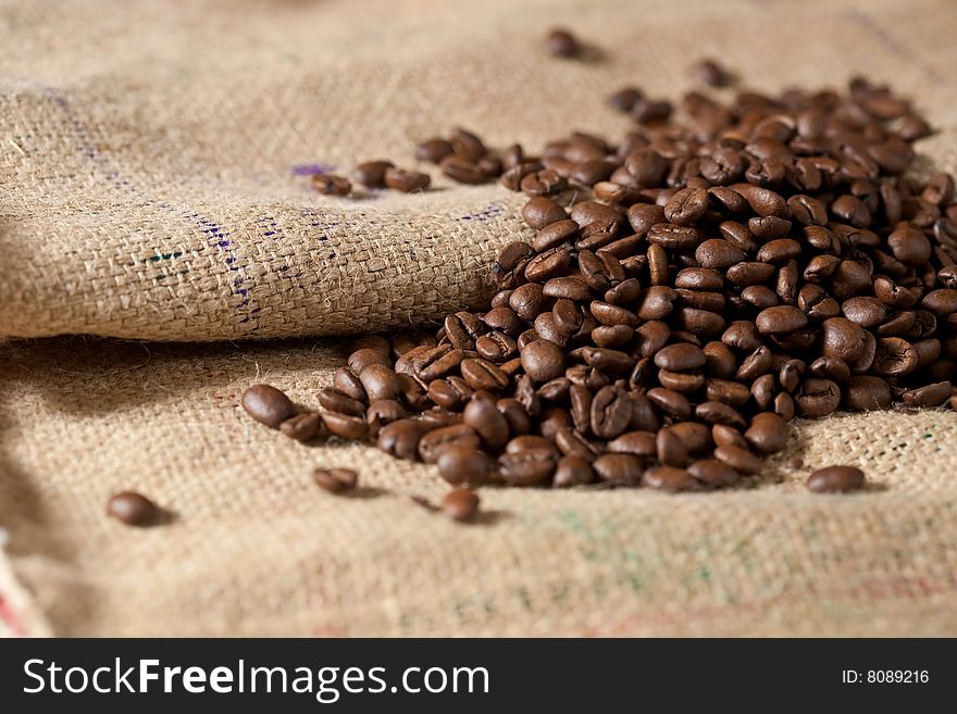 Close-up of roasted coffee beans on burlap