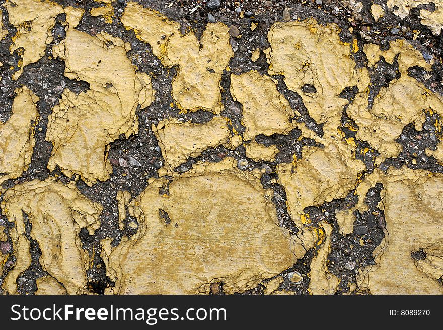Abstract background of cracking yellow paint on asphalt. Abstract background of cracking yellow paint on asphalt.