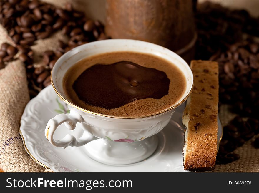 Cup of coffee and biscotti cookie