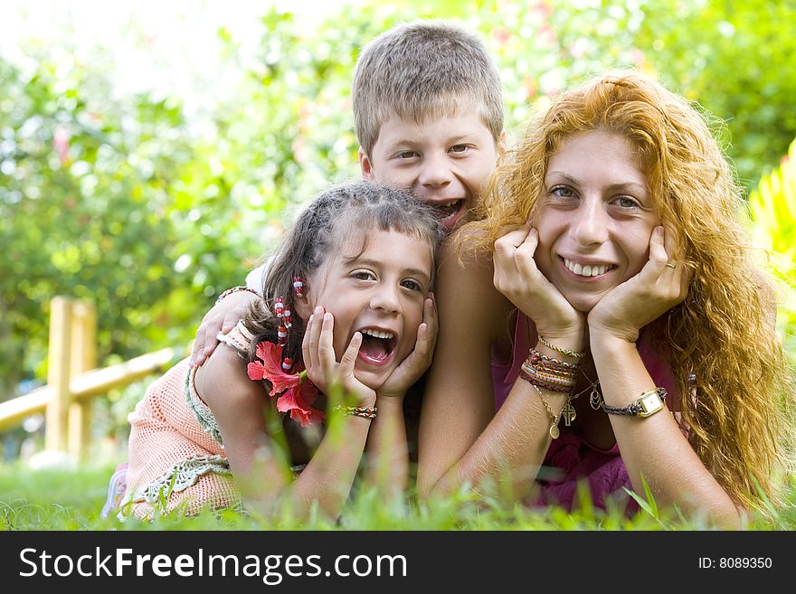 Portrait of little kids with mama  having good time in summer environment. Portrait of little kids with mama  having good time in summer environment