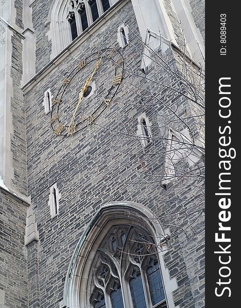 Clock on the tower's wall. Clock on the tower's wall