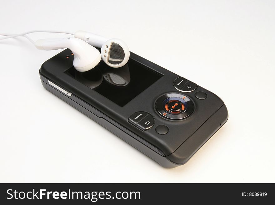 MP3 Player Cell Phone with earbuds on white background. MP3 Player Cell Phone with earbuds on white background