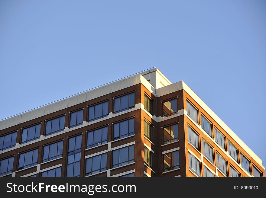 The corner of a building with an orange-colored brick exterior. The corner of a building with an orange-colored brick exterior.