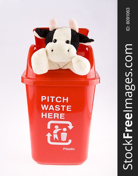 A red recycling bin of recyclable doll. A red recycling bin of recyclable doll