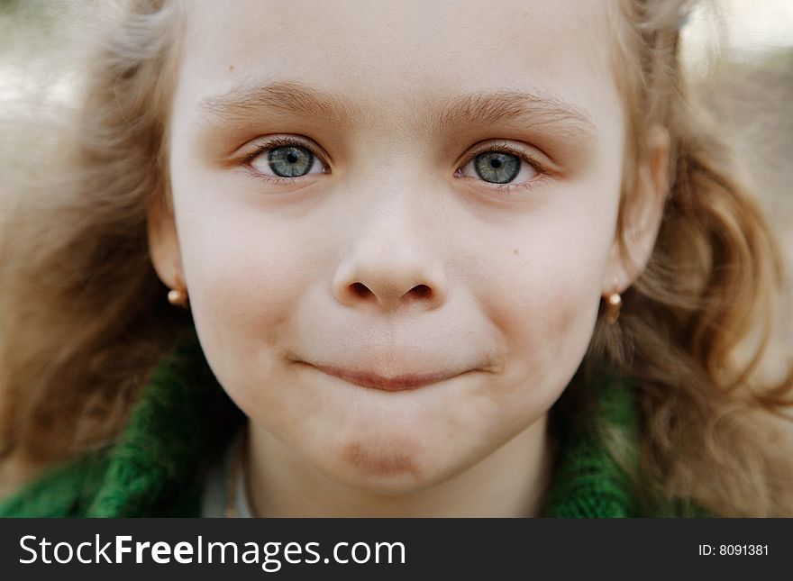 Portrait of the cheerful little girl