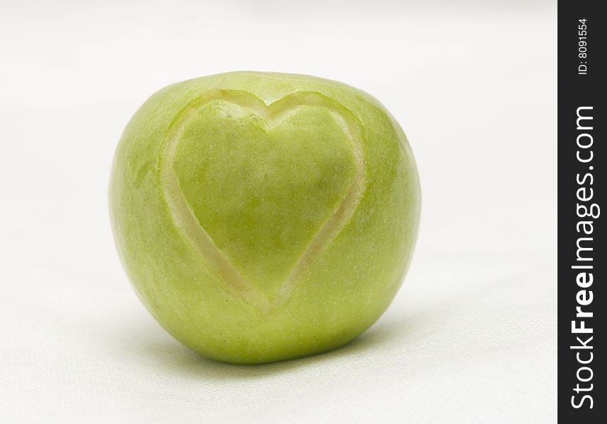 The image of the apple on which heart is cut out. The image of the apple on which heart is cut out