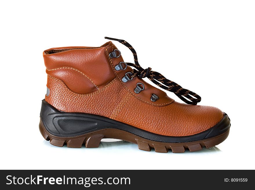 Close-up of one new steel-toed safety shoe against a white background