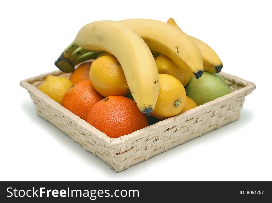 Isolated basket filled with fruits. Isolated basket filled with fruits