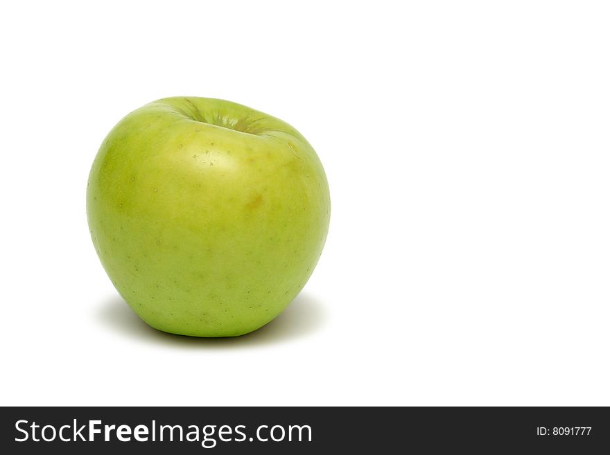 Fresh green apple isolated on the white background pointed to the left. Fresh green apple isolated on the white background pointed to the left