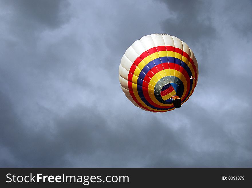 A coloured balloon is flying inside dangerous storm clouds ... Italy-caripneti (RE). A coloured balloon is flying inside dangerous storm clouds ... Italy-caripneti (RE).