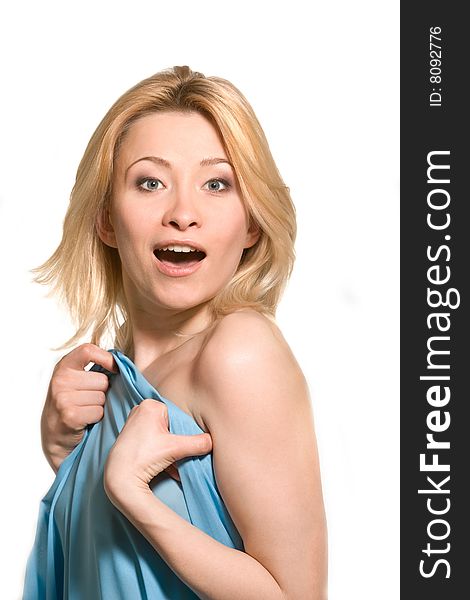 Surprised woman behind blue fabric