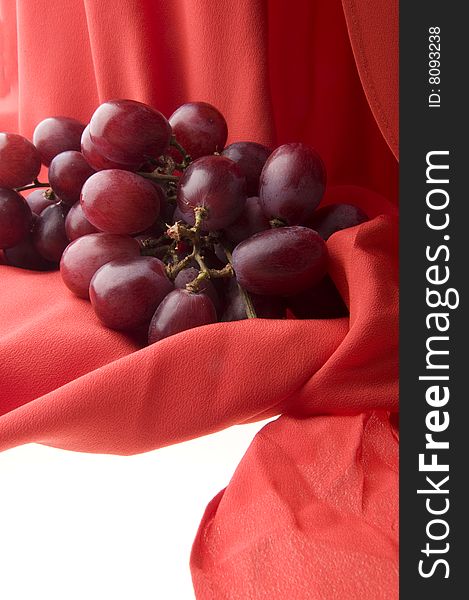 Grapes on red scarf background