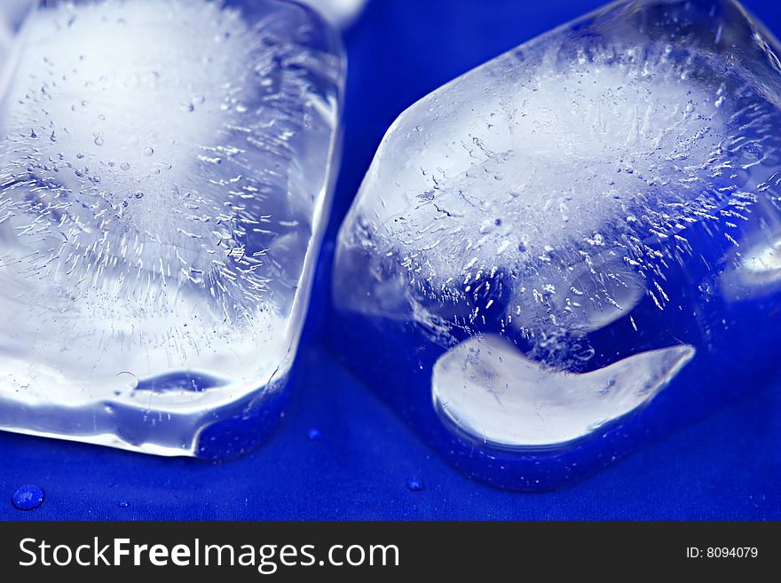 Cubes of ice on a bright blue background. Cubes of ice on a bright blue background