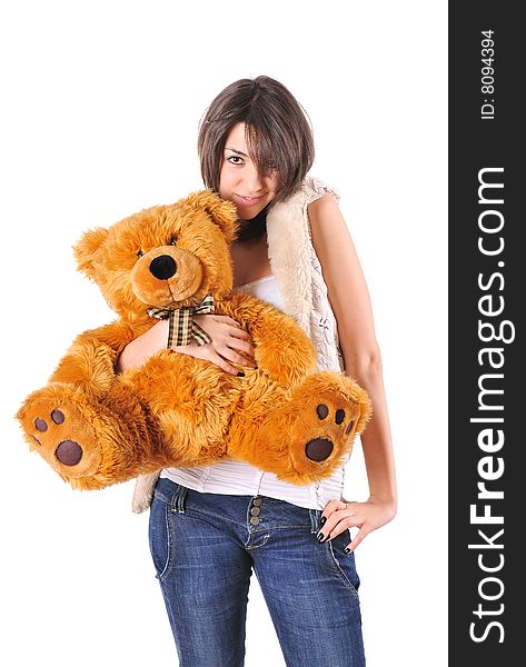 Girl hugging a Teddy bear on white background. Girl hugging a Teddy bear on white background