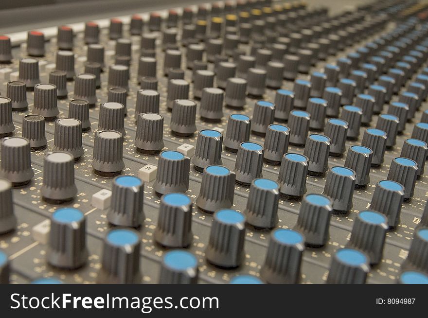 Closeup of knobs of a sound mixer. Closeup of knobs of a sound mixer.