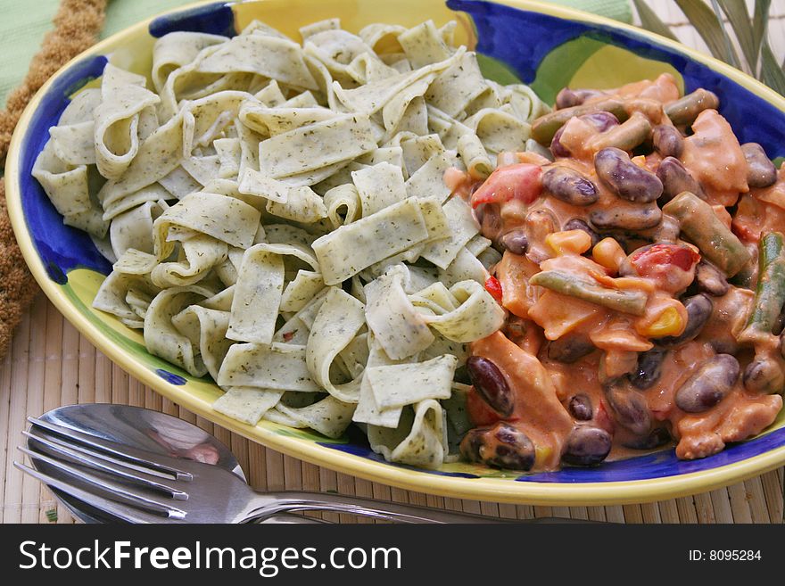 Fresh meat with mexican vegetables and noodles in a bowl. Fresh meat with mexican vegetables and noodles in a bowl