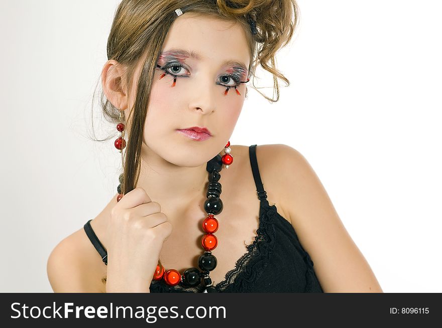 Young fashion girl with special eye makeup, jewelry and black top