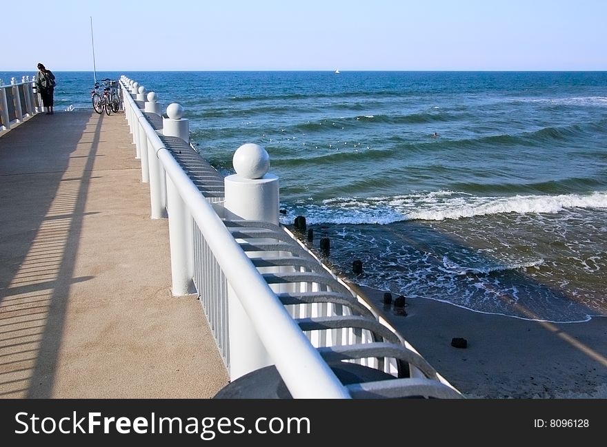 View on a large pier at the Baltic sea coast. View on a large pier at the Baltic sea coast