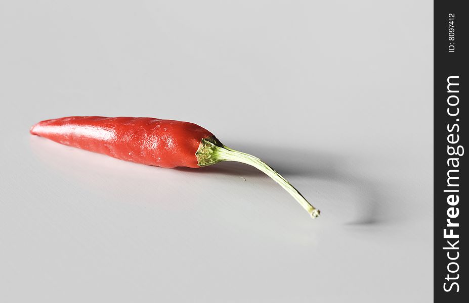 Red hot pepper on white with drop shadow