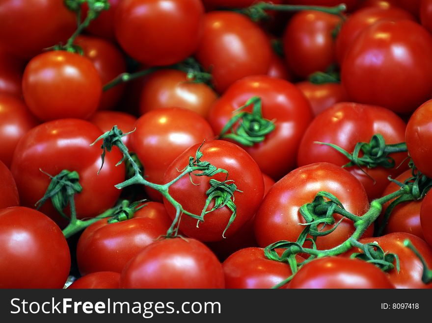 Shiny fresh looking pile of red tomatoes. Shiny fresh looking pile of red tomatoes