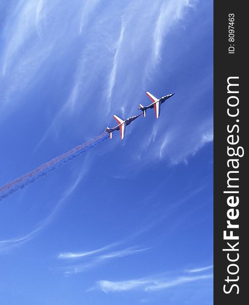 Two fighters stunting during an air show.