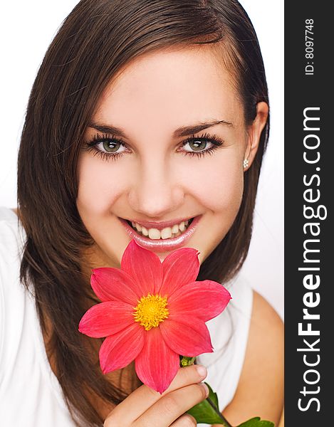 Young beautiful brunette with flower close up shoot