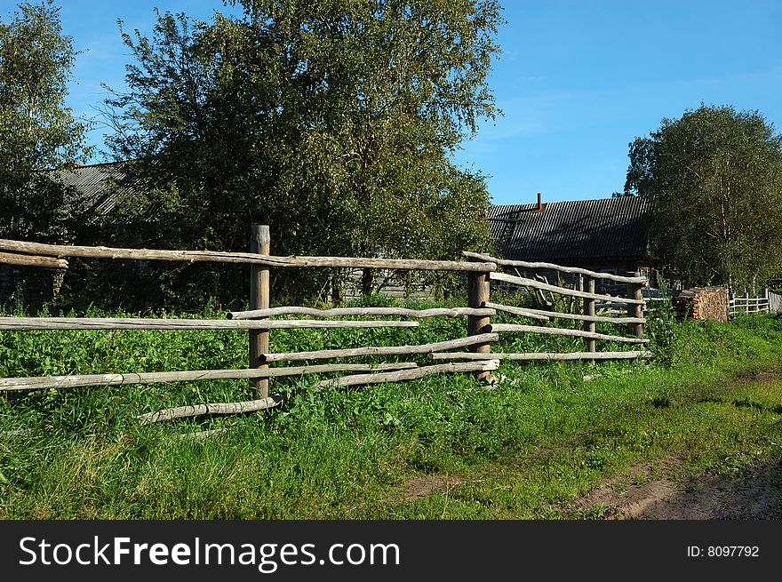 View of pole fence in northern russian village. View of pole fence in northern russian village