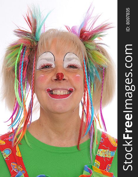 Clown's portrait smiling with colorful hair